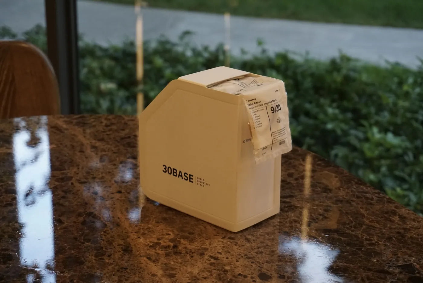 A 30BASE box on a stone ledge.