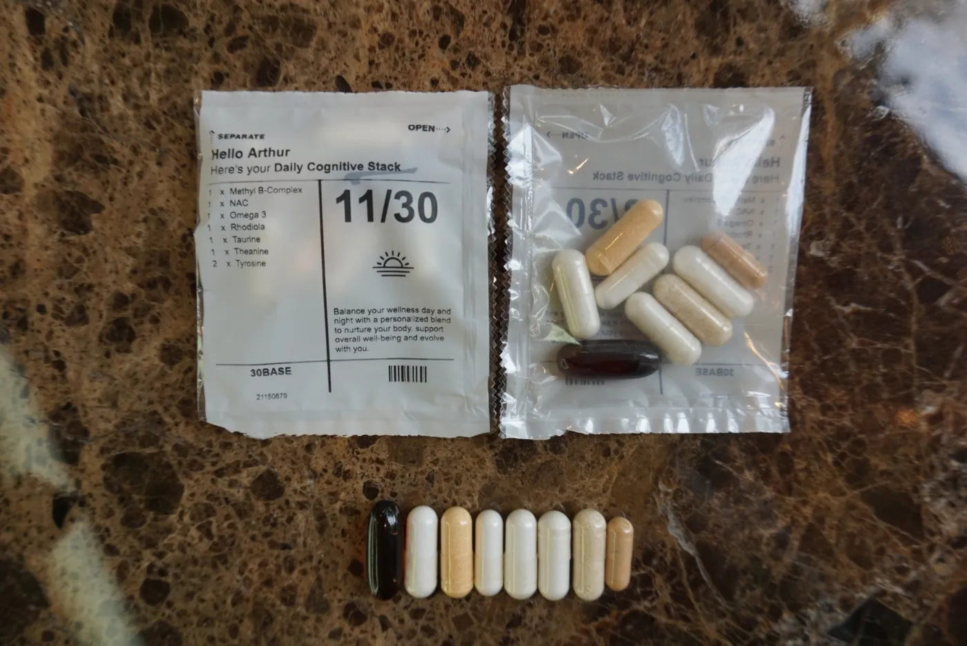 A 30BASE box, sachet, and capsules arranged on a granite surface.